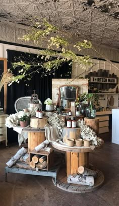 a room filled with lots of different types of furniture and flowers on top of it