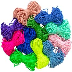 many colors of string on a white background