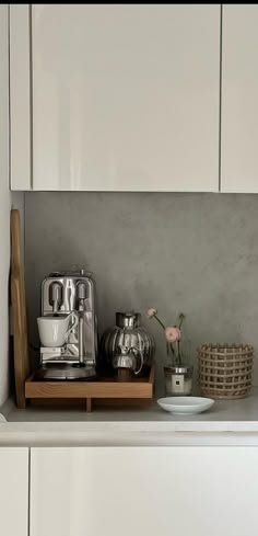 the kitchen counter is clean and ready to be used as a coffee maker or mixer