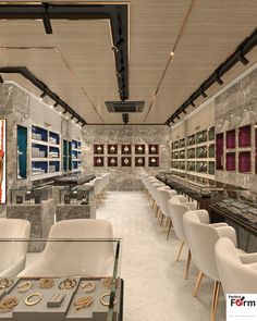 a room filled with lots of tables covered in white chairs and gold rings on them