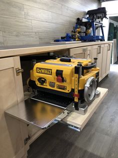 a yellow and black work bench in a kitchen