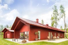 a large red house with a metal roof