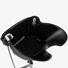 a black and white photo of an office chair with wheels on the bottom, in front of a white background