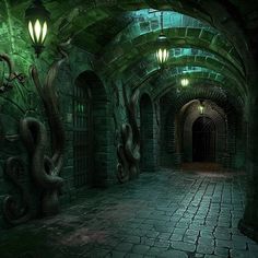 an underground tunnel with lights and snakes on the walls, in which there is a lantern