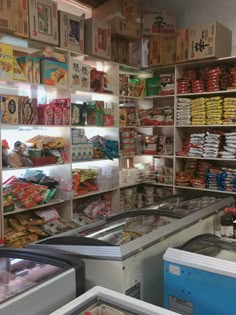 a store filled with lots of different types of food and snacks on shelves next to each other