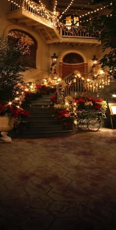 a staircase with christmas lights and decorations on it