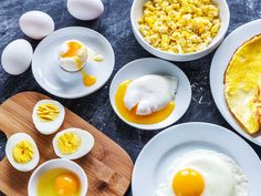 an assortment of eggs and other foods on plates