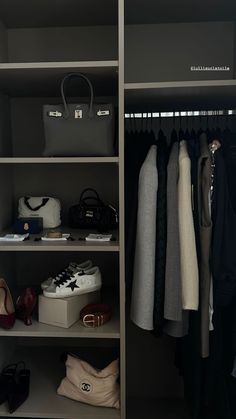 an organized closet with clothes and handbags