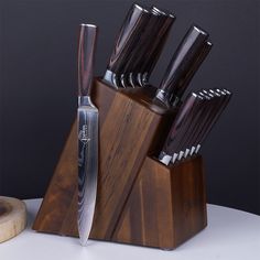 a knife holder with several knives in it