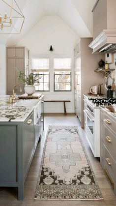 a kitchen with an area rug on the floor