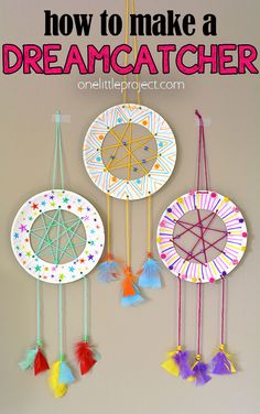 paper plate dream catchers hanging on the wall with text overlay that says how to make a dream catcher