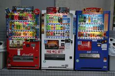 three vending machines sitting next to each other