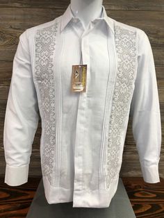 Beautiful Elegant Handcrafted Guayabera Shirt  Made in Merida Yucatan Mexico Cotton Polyester Blend Long Sleeve  Silver Double Cross Stitch Embroidery  High Quality Product  100% New Product. Perfect for Every Occasion: Ideal for weddings, fiestas, tropical getaways, birthdays, or any event that calls for sophistication. We do accept returns. We do charge a 25% fee on returns.  No charge on Exchanges. You are responsible for shipping item back to us.  Thank You and God bless you. Guayabera Wedding Outfit, Guayabera Outfit For Men, Guayabera Outfit, Guayabera Wedding, Guayabera Dress, Mexican Style Wedding, Vintage Mexican Wedding, Wedding Dress Shirt, Wedding Fiesta