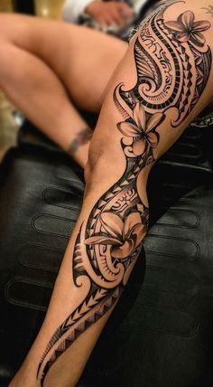 a woman with a tattoo on her leg