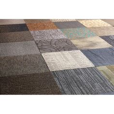 a multicolored patchwork rug on the floor