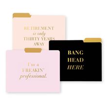 three different colored folders with gold foil lettering on the front and back of them