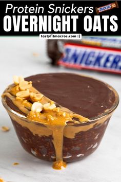 a chocolate dessert with peanut butter drizzled over it and the words protein snickkers overnight oats