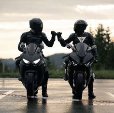 two motorcyclists in black leather jackets on their motorcycles