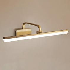 a bathroom light that is on the wall