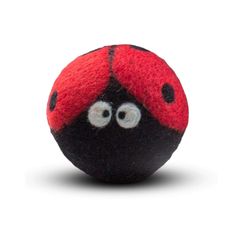 a black and red ball with eyes on it