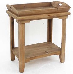 a small wooden table with a tray on it's top and shelf below the legs