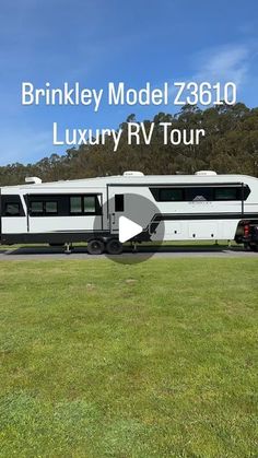 an rv is parked on the side of the road in front of some trees and grass