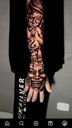 a man with a tattoo on his arm and hand is shown in the image, while he