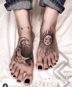 two feet with sun and moon tattoos on them