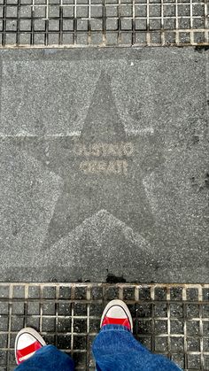 a person standing in front of a star on the ground