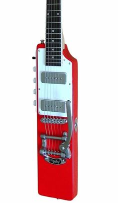 a red and white guitar shaped like a music box with an electric guitar attached to it