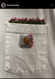 a pocket with some pink flowers in it