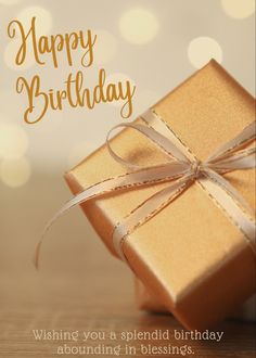 a birthday card with a gold present wrapped in brown paper and the words, happy birthday wishing you a splendid birthday abounding in blessing