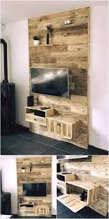 the pallet tv stand is made out of wooden planks and has drawers on each side