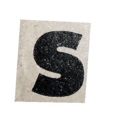 the letter s is made out of black and white paper