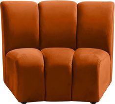 an orange couch with three square shaped cushions on it's back legs and arms