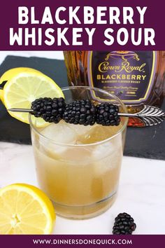 blackberry whiskey sour with lemons and blackberries on the side