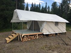 a white tent with stairs leading up to it