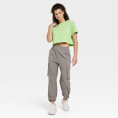 These Cinch Hem Woven Cargo Pants from JoyLab™ make a go-to pick for kickboxing or enjoying a walk in the park. In a casual fit, the high-rise cargo pants are crafted from stretchy midweight fabric to offer cool comfort through any activity. The elastic waistband and cinched hems at the ankle give you a stay-put fit, while side and cargo pockets provide space to stash your phone or other essentials. Pair these cargo pants with a tank top, tee or sweatshirt for versatile styling options. JoyLab™: Gym Workouts Women, Casual Joggers, Walk In The Park, Women's Workout, French Terry Fabric, Cargo Pocket, Sports Activities, Workout Gym, Womens Clothing Sizes