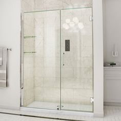 a walk in shower sitting next to a bath tub and white tiled floored walls