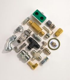 many different types and sizes of hardware on a white surface