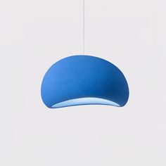 a blue light hanging from a white ceiling