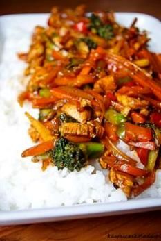 a white plate topped with rice and veggies