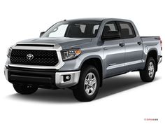 a silver toyota tundra is shown in this studio photo from the front view, it appears to be on display