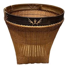 a brown basket with black and gold trim