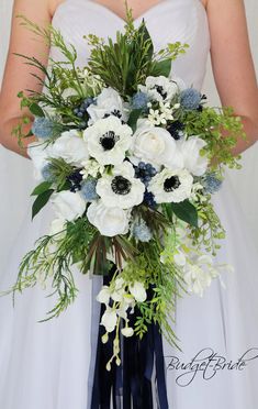 a bridal holding a bouquet of white and blue flowers