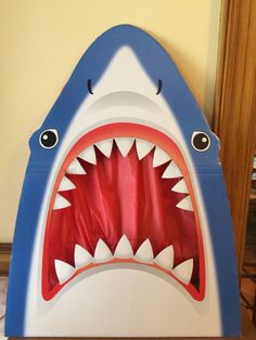 an inflatable shark with its mouth open and it's teeth wide open