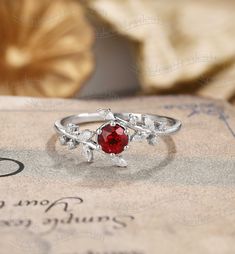 Engagement Ring Details Lab Ruby Engagement Ring, Leaf Round Ruby Ring White Gold, Flower Branch Ring, Twig Ruby Ring, Antique Promise Ring Ring#:NC1177 Center stone: Lab Ruby Round cut Size/Weight:5mm Side stones: moissanite or diamonds Custom orders are most welcome! Please feel free to ask for any item, any adjustments or anything else you want me to make. Rush order Orders can be expedited for a fee. If your order needs to be expedited, please contact us ASAP. Layaway plan We offer layaway p Ruby Engagement Ring White Gold, Silver Ruby Engagement Ring, Ruby Ring Silver, Ruby Promise Ring, Ruby Engagement Ring Silver, Vintage Ruby Ring, Antique Promise Rings, White Gold Ruby Ring, Red Engagement Ring