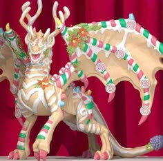 a statue of a dragon with candy canes on it's back and arms