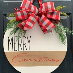 a christmas door hanger with a red and white checkered bow hanging from it's side