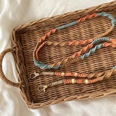 a wicker basket with some beads on it